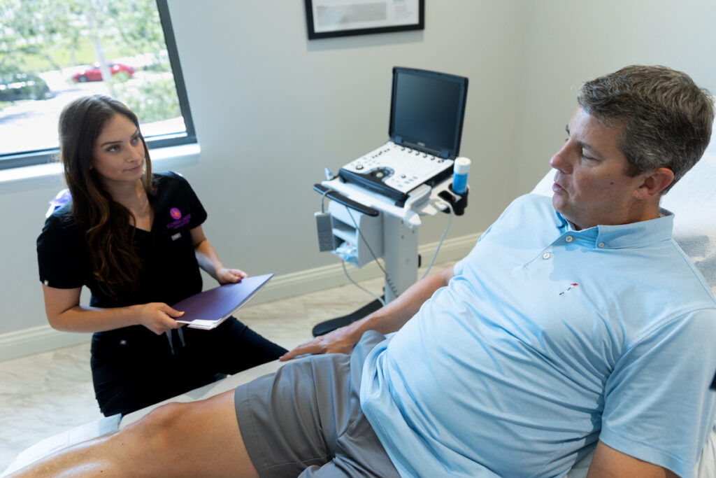 Florida Lakes Vein Center specialist talking to a client at the vein clinic near me in Englewood, FL